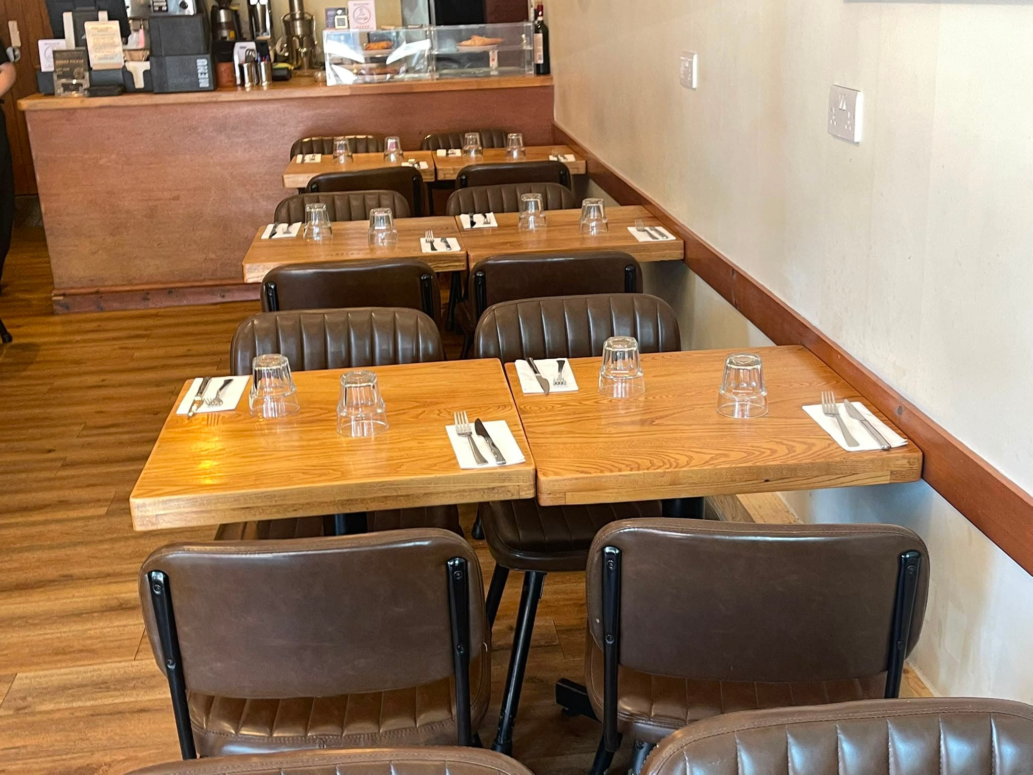 Booth seating at Greek Unique